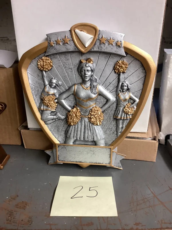 SILVER CHEER SHIELD W/GOLD ACCENTS AND 3 CHEERLEADERS