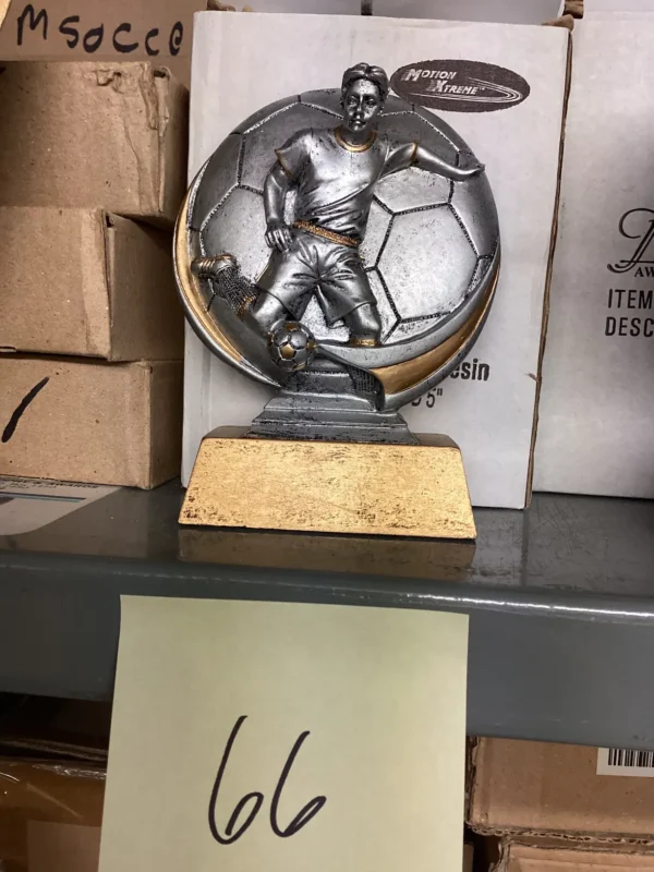 SILVER MALE IN FRONT OF SOCCER BALL ON BRONZE BASE