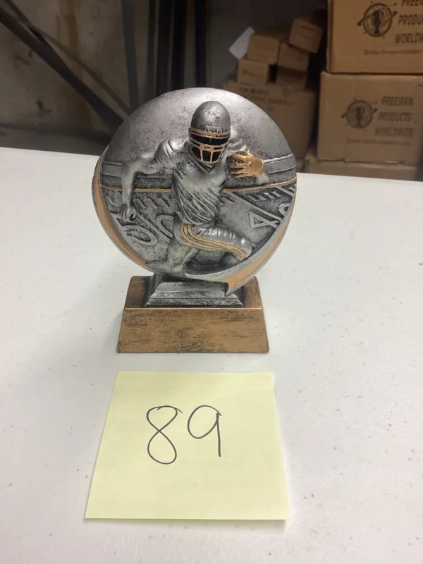 SILVER FOOTBALL CARRIER ON BRONZE BASE