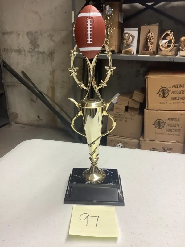 GOLD FOOTBALL TROPHY ON BLK BASE