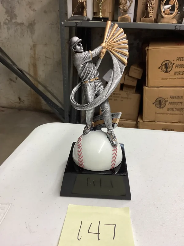 SILVER BASEBALL HITTER ON BASEBALL BASE