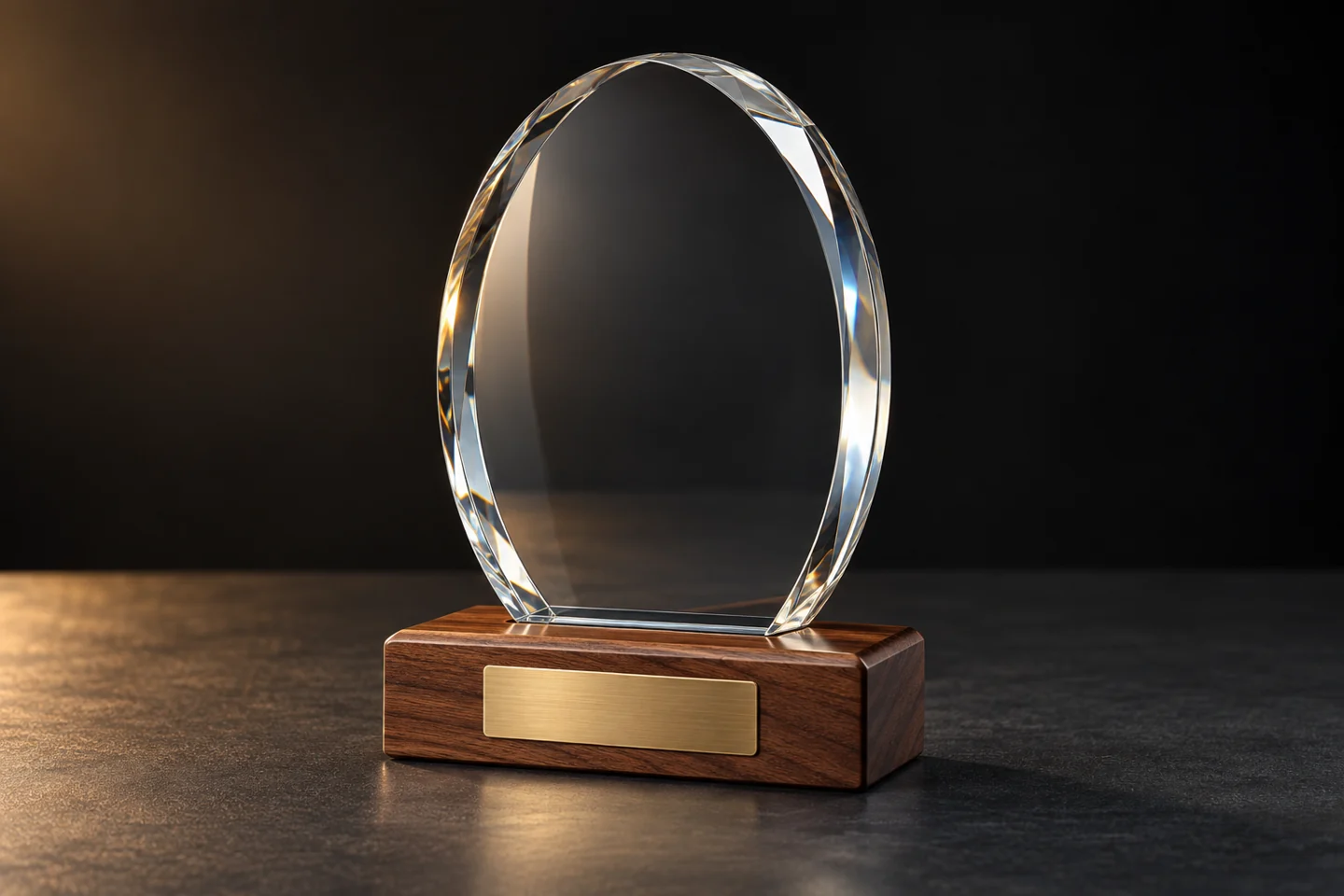 Illustration of an oval glass trophy on a walnut base with a brass plate.